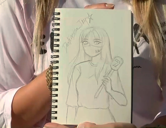 Peke muestra su dibujo